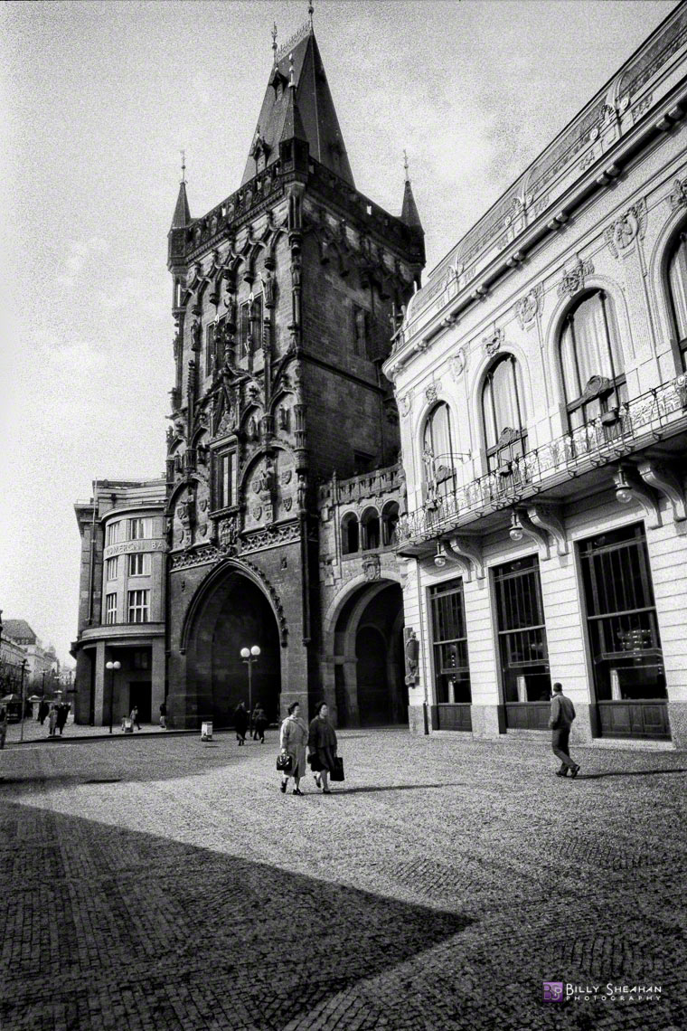 Women_walking_near_Prasna_brana_(Powder_Tower),_Prague,_Czech_Republic_Prague-644_14_BW_D